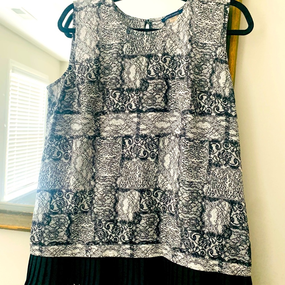 Tommy Hilfiger black and white sleeveless blouse with pleats at the bottom.